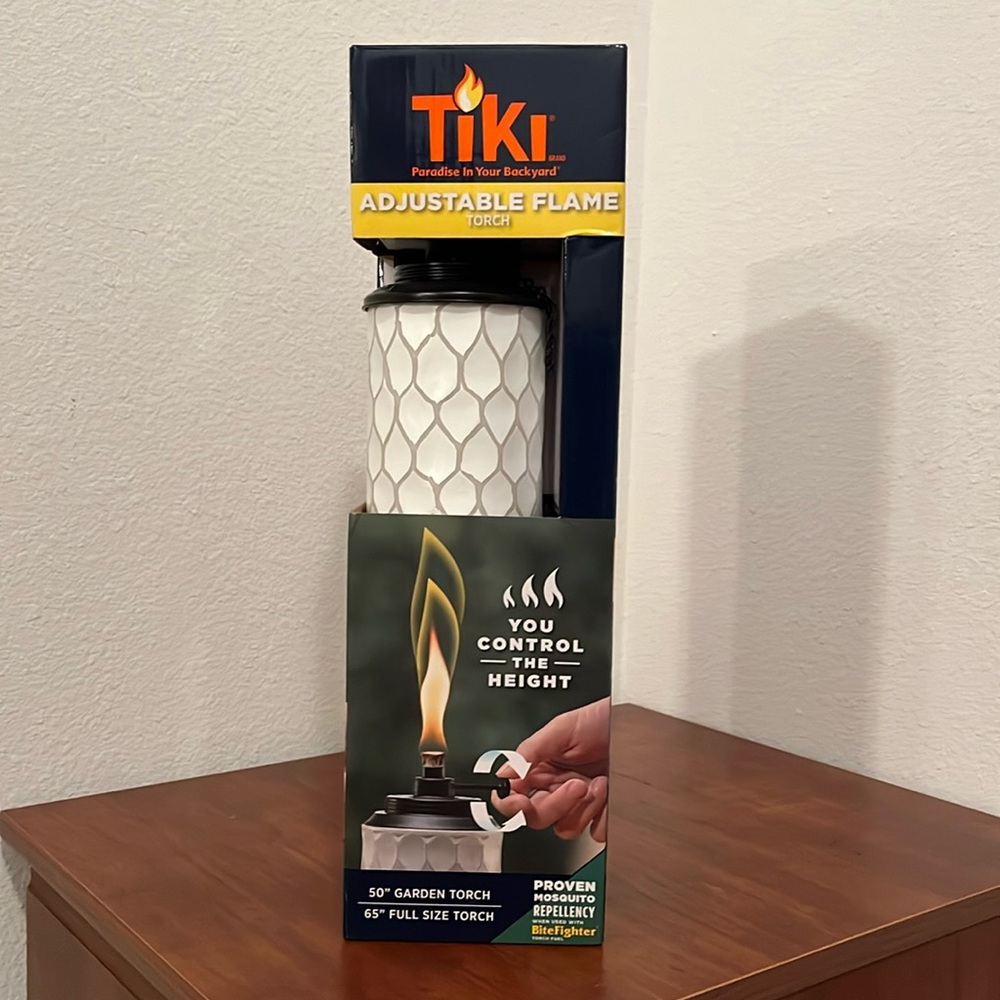 New in box Tiki Torch adjustable flame torch